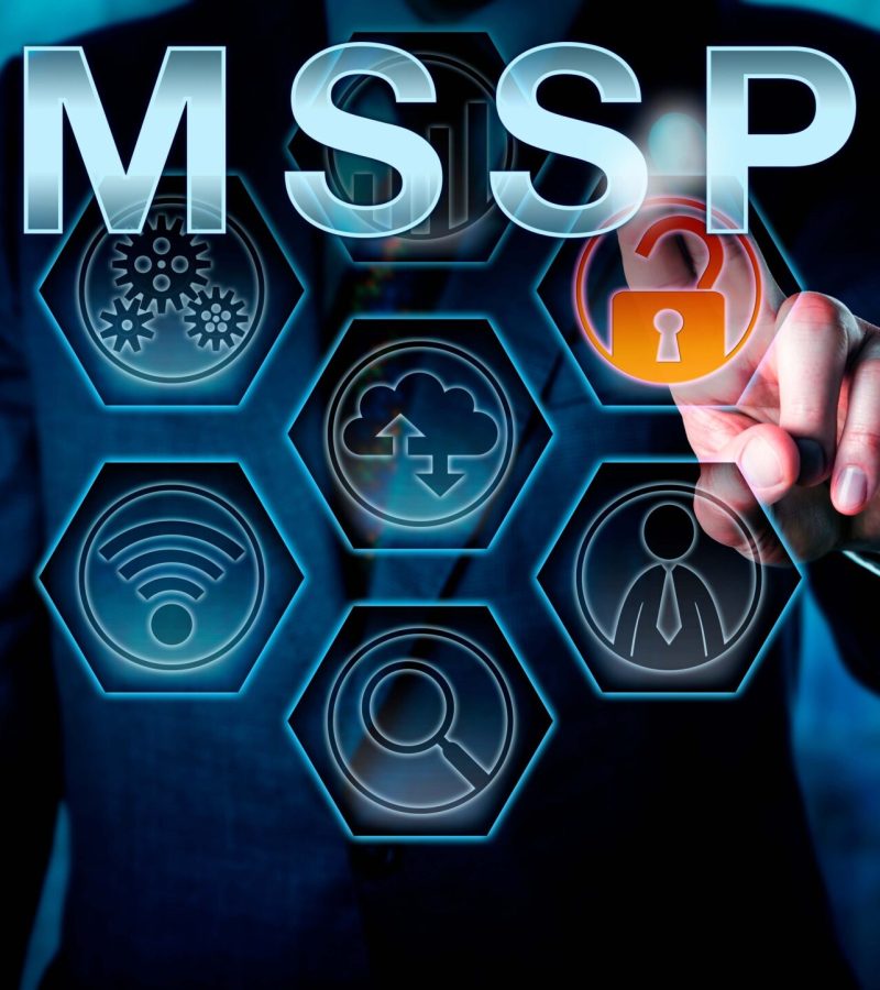 Corporate Network Administrator Pushing MSSP Male corporate network administrator is touching MSSP on an interactive virtual control screen. Business model metaphor and information technology concept for managed security service provider.